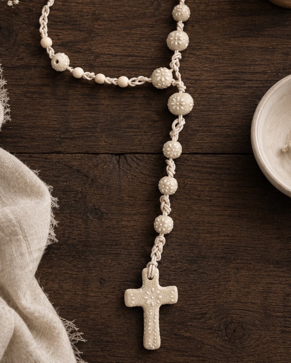 Ivory handmade wedding lasso with lace-style beadwork, eternity knotwork, and a ceramic cross